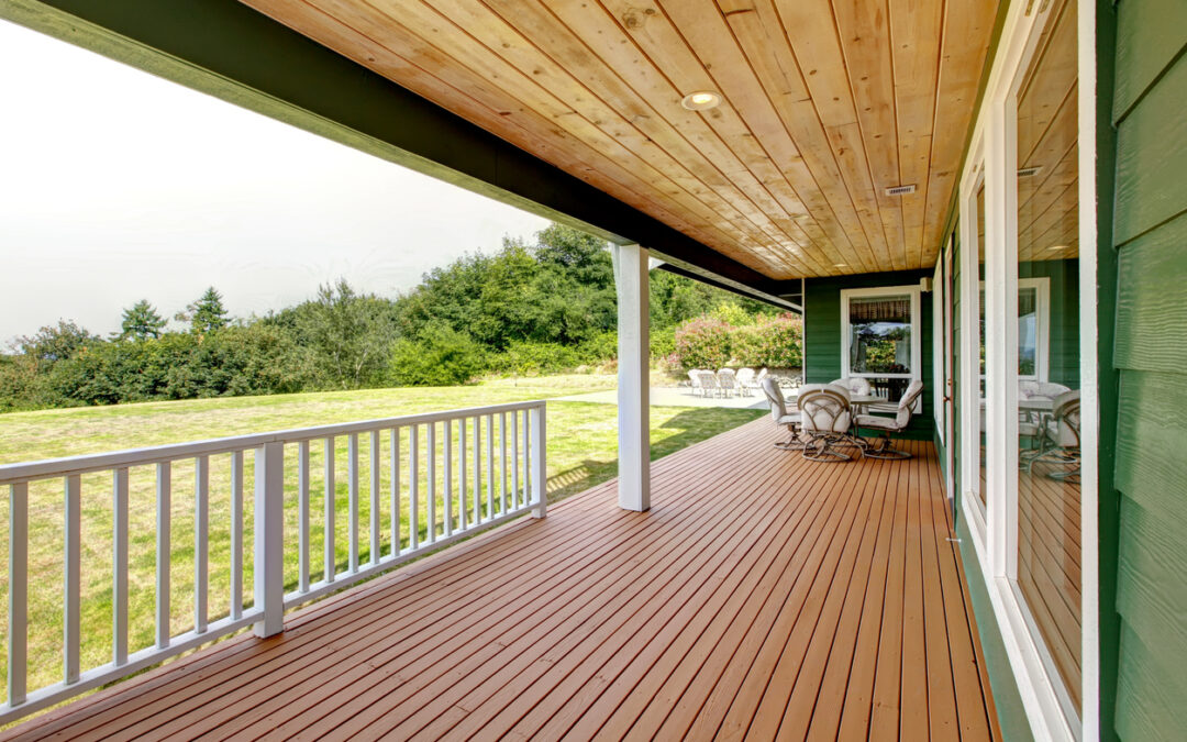Photo of deck overlooking a grassy hill -underdeck drainage success